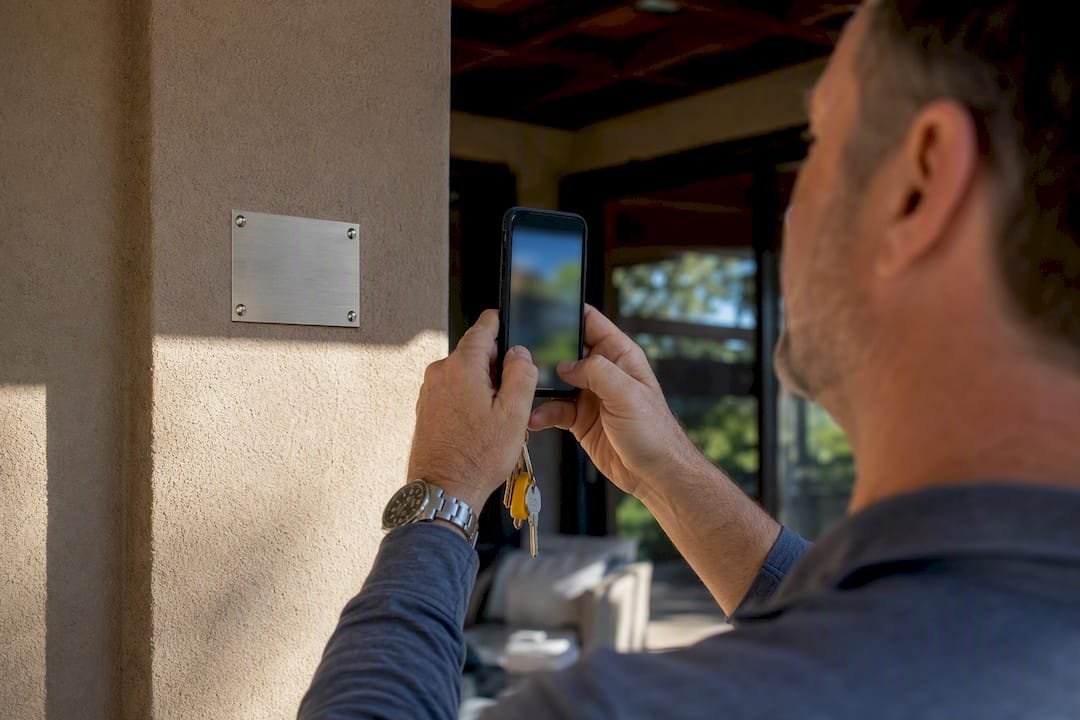 Owner photographing a rental permit placard